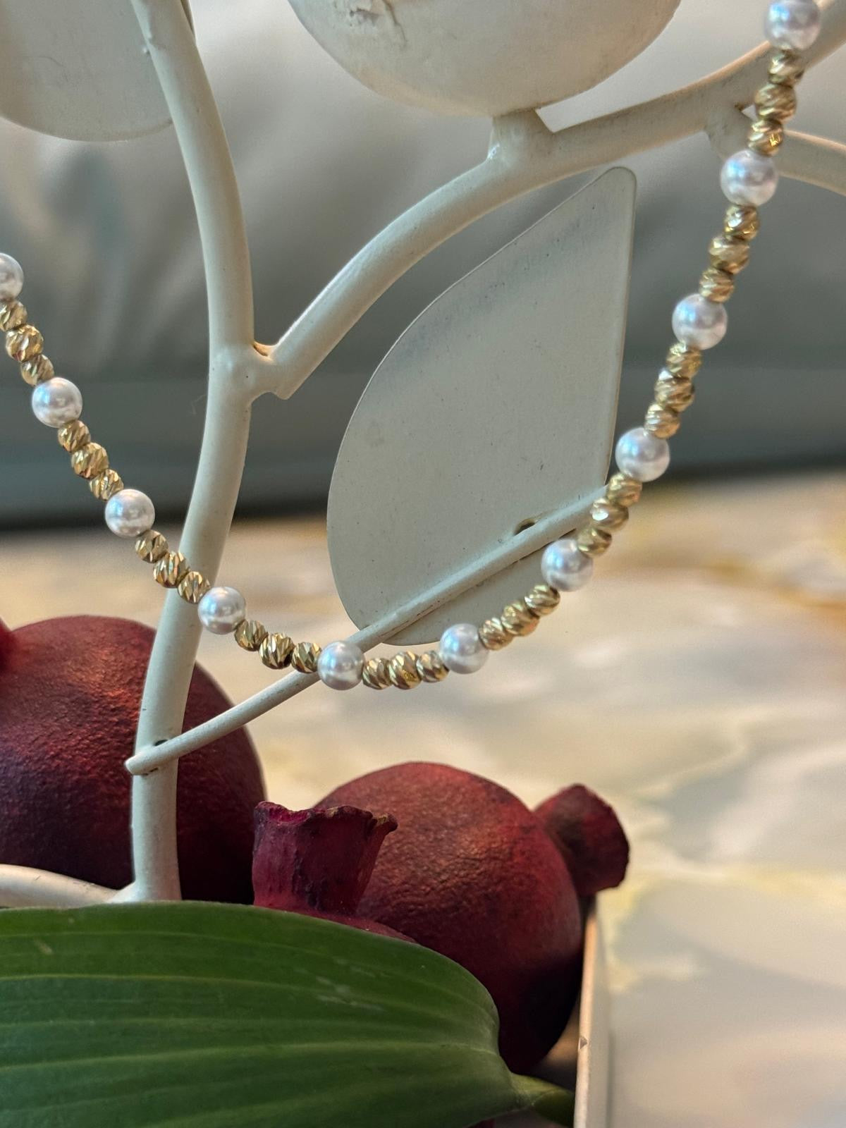 Solid gold and imitation pearl necklace