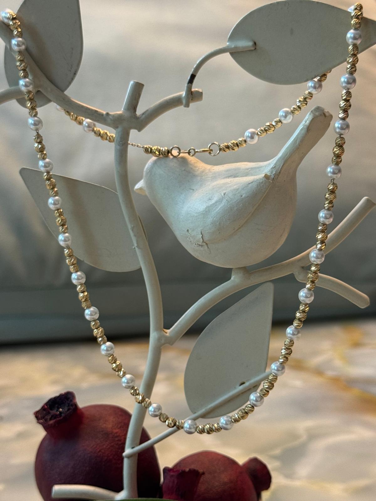 Solid gold and imitation pearl necklace